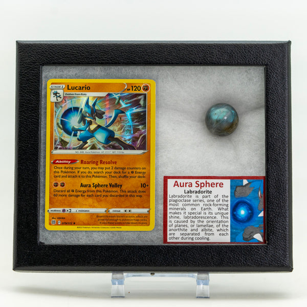 Pokémon trading card with Lucario and a labradorite stone in a display case.