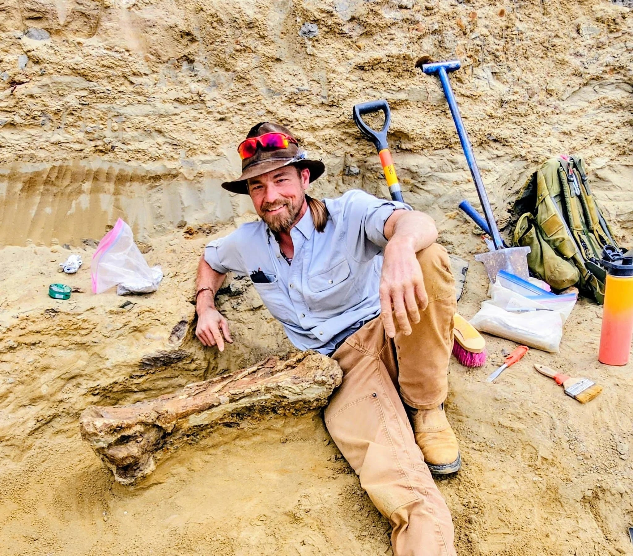 Chase Pipes working at a fossil dig